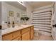 Bathroom with a large mirror, vanity, shower curtain, and decorative accents at 3088 Paseo Mountain Ave, Henderson, NV 89052