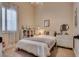 Bright bedroom features a plush bed, ample natural light, and built in shelving at 3088 Paseo Mountain Ave, Henderson, NV 89052