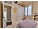 Cozy bedroom features plush carpet, window with blinds, and en suite entry at 3088 Paseo Mountain Ave, Henderson, NV 89052