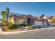 Charming single-story home with a tile roof, three-car garage, solar panels, and drought-resistant landscaping at 3088 Paseo Mountain Ave, Henderson, NV 89052