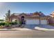 Charming single-story home with a tile roof, three-car garage, solar panels, and low-maintenance landscaping at 3088 Paseo Mountain Ave, Henderson, NV 89052