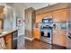 An inviting kitchen features granite countertops, stainless steel appliances, and hardwood floors at 3088 Paseo Mountain Ave, Henderson, NV 89052