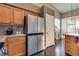 A modern kitchen with stainless steel appliances, granite countertops, and hardwood floors at 3088 Paseo Mountain Ave, Henderson, NV 89052