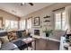 Comfortable living room with a cozy fireplace and lots of natural light at 3088 Paseo Mountain Ave, Henderson, NV 89052