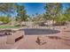 Community park featuring shaded swings, picnic table, and a walking path at 3088 Paseo Mountain Ave, Henderson, NV 89052