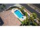 Aerial view of a sparkling pool and spa surrounded by lush landscaping at 3088 Paseo Mountain Ave, Henderson, NV 89052