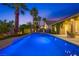 Inviting backyard pool with lush landscaping and outdoor seating for relaxing evenings at 3088 Paseo Mountain Ave, Henderson, NV 89052