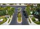 View of manicured entrance to community with a center median featuring an ornamental planting at 3088 Paseo Mountain Ave, Henderson, NV 89052