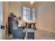Cozy study features bright window, desk, and comfortable arm chair with foot stool at 3088 Paseo Mountain Ave, Henderson, NV 89052