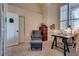 Cozy study features bright window, desk, and comfortable arm chair with foot stool at 3088 Paseo Mountain Ave, Henderson, NV 89052