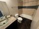 Bathroom showcases a granite vanity, toilet, and tiled tub and shower at 3151 Soaring Gulls Dr # 1074, Las Vegas, NV 89128
