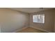 Bedroom with laminate floors, neutral paint, and a window with blinds at 3151 Soaring Gulls Dr # 1074, Las Vegas, NV 89128