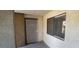 A secure front door with a security screen door and a window located to the right side at 3151 Soaring Gulls Dr # 1074, Las Vegas, NV 89128