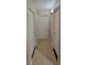 Hallway with laminate floors and a row of doors at 3151 Soaring Gulls Dr # 1074, Las Vegas, NV 89128