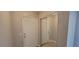 Hallway featuring neutral paint, wood-look floors, and closet doors to the right at 3151 Soaring Gulls Dr # 1074, Las Vegas, NV 89128