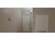 Hallway view featuring a white door, thermostat, and heater at 3151 Soaring Gulls Dr # 1074, Las Vegas, NV 89128
