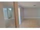 An open-concept living room with new, light-colored laminate flooring with gray walls at 3151 Soaring Gulls Dr # 1074, Las Vegas, NV 89128