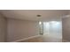 Living room featuring neutral paint, wood-look floors, and a view to the doorway at 3151 Soaring Gulls Dr # 1074, Las Vegas, NV 89128