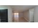 Living room featuring neutral paint, wood-look floors, access to a slider, and doorway at 3151 Soaring Gulls Dr # 1074, Las Vegas, NV 89128