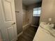 Well-lit bathroom with a tub, shower, and a modern vanity with stylish sink at 3340 Shallow Pond Dr, Las Vegas, NV 89117