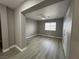 Bedroom featuring wood look flooring, a ceiling fan, and a window at 3340 Shallow Pond Dr, Las Vegas, NV 89117