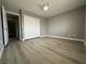 Bedroom showcasing wood look flooring and a closet with sliding doors at 3340 Shallow Pond Dr, Las Vegas, NV 89117