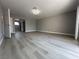 Spacious, bright bedroom featuring modern flooring and neutral gray walls at 3340 Shallow Pond Dr, Las Vegas, NV 89117