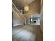 Inviting foyer with wood floors, a staircase, and an adjacent view of the living room at 3340 Shallow Pond Dr, Las Vegas, NV 89117