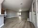 Spacious living room featuring wood-look flooring and ample natural light at 3340 Shallow Pond Dr, Las Vegas, NV 89117