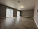 Spacious living room with modern flooring and glass doors opening to the outside at 3340 Shallow Pond Dr, Las Vegas, NV 89117