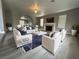 Elegant living room featuring a fireplace, modern furniture, and stylish decor at 3340 Shallow Pond Dr, Las Vegas, NV 89117