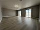 Bright living room with contemporary flooring and sliding doors offering backyard access at 3340 Shallow Pond Dr, Las Vegas, NV 89117