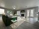 Cozy living room with a fireplace and access to the backyard through double doors at 3340 Shallow Pond Dr, Las Vegas, NV 89117