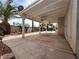 Covered outdoor patio with a fan and access to the landscaped backyard at 3340 Shallow Pond Dr, Las Vegas, NV 89117