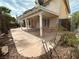 Covered patio featuring fan, stone pavers, and access to the backyard at 3340 Shallow Pond Dr, Las Vegas, NV 89117
