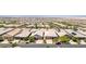 Wide angle aerial of suburban homes and beautifully maintained streets in a vibrant community near the mountains at 379 Mano Destra Ln, Henderson, NV 89011