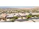 An elevated aerial view of a suburban neighborhood filled with single-story homes with desert landscaping at 379 Mano Destra Ln, Henderson, NV 89011