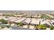 An elevated aerial view of a suburban neighborhood filled with single-story homes, desert landscaping, and paved streets at 379 Mano Destra Ln, Henderson, NV 89011