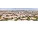 A landscape aerial showing suburban homes in a vibrant community near mountains and city skyline at 379 Mano Destra Ln, Henderson, NV 89011