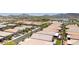 Landscape aerial shot showing suburban homes in a desert community surrounded by mountains and clear skies at 379 Mano Destra Ln, Henderson, NV 89011