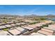 Elevated aerial view of a vibrant community near mountains showing desert landscaping and well-maintained properties at 379 Mano Destra Ln, Henderson, NV 89011