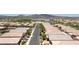 A long angle aerial showing suburban homes in a vibrant community. Desert landscape and paved streets at 379 Mano Destra Ln, Henderson, NV 89011