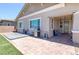 Comfortable back patio area with grill, outdoor seating and durable brick flooring at 379 Mano Destra Ln, Henderson, NV 89011