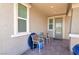 Charming covered patio area with comfortable seating, creating a cozy outdoor living space at 379 Mano Destra Ln, Henderson, NV 89011