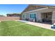 Spacious backyard with lush lawn and patio, ideal for outdoor activities and relaxation at 379 Mano Destra Ln, Henderson, NV 89011