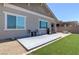 Outdoor patio with artificial turf and seating area for relaxation at 379 Mano Destra Ln, Henderson, NV 89011