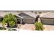 Beautiful home featuring a well-manicured lawn, a paver driveway and an attached two car garage at 379 Mano Destra Ln, Henderson, NV 89011