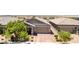 Beautiful single-story home features a desert landscape, brick paved driveway, and an attached two-car garage at 379 Mano Destra Ln, Henderson, NV 89011