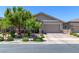 Charming single-story home with manicured landscaping and a brick driveway at 379 Mano Destra Ln, Henderson, NV 89011