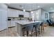 Bright kitchen featuring a large island with seating, pendant lighting, and stainless steel appliances at 379 Mano Destra Ln, Henderson, NV 89011